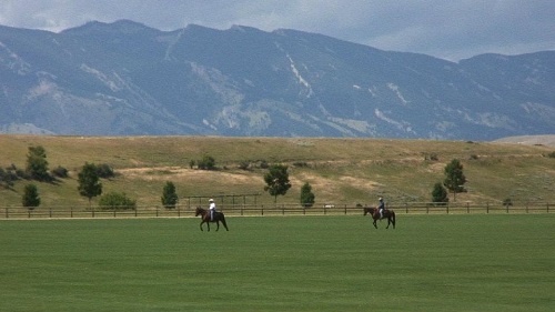 Nick riding horses with his dad in Wyoming